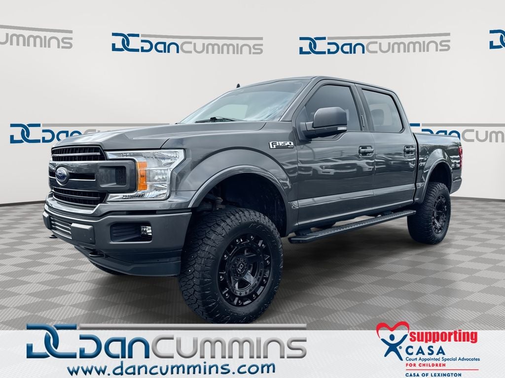 2019 Ford F-150 XLT in Magnetic — front three-quarter view