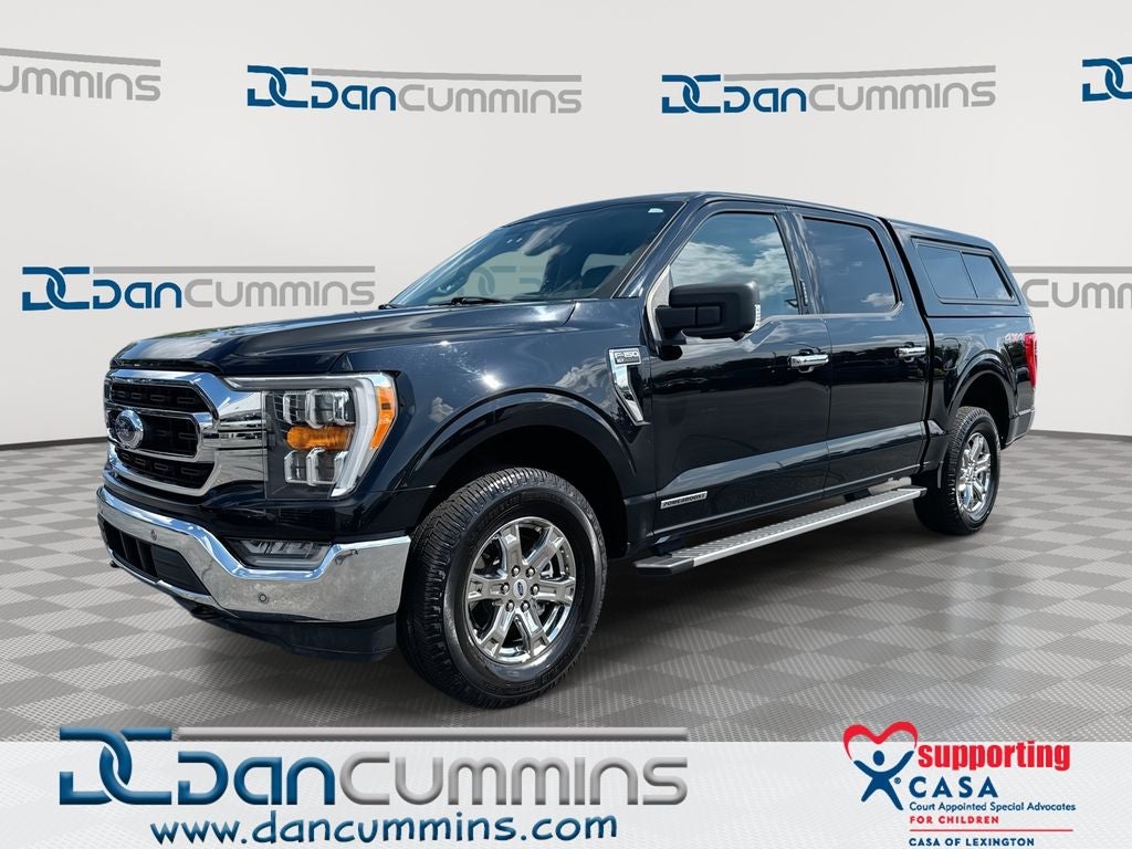 2023 Ford F-150 XLT in Black Metallic — front three-quarter view