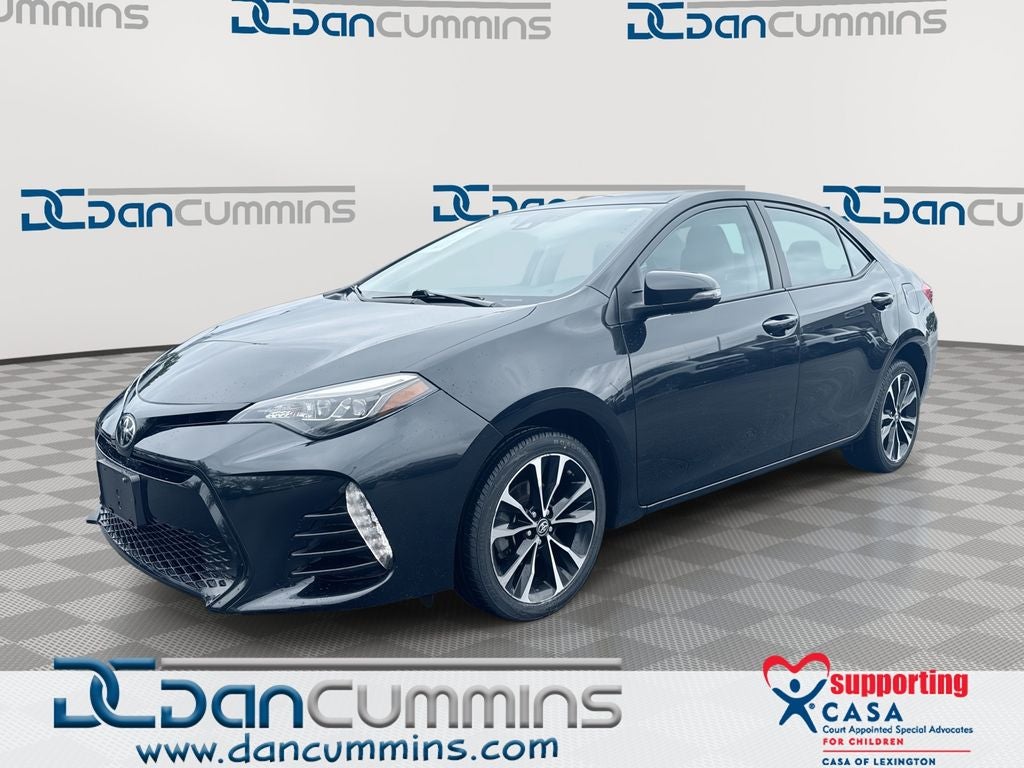2017 Toyota Corolla SE in Black Sand Pearl — front three-quarter view