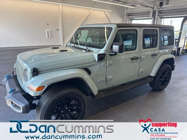 2023 Jeep Wrangler Sahara 4xe in Earl Clearcoat — front three-quarter view