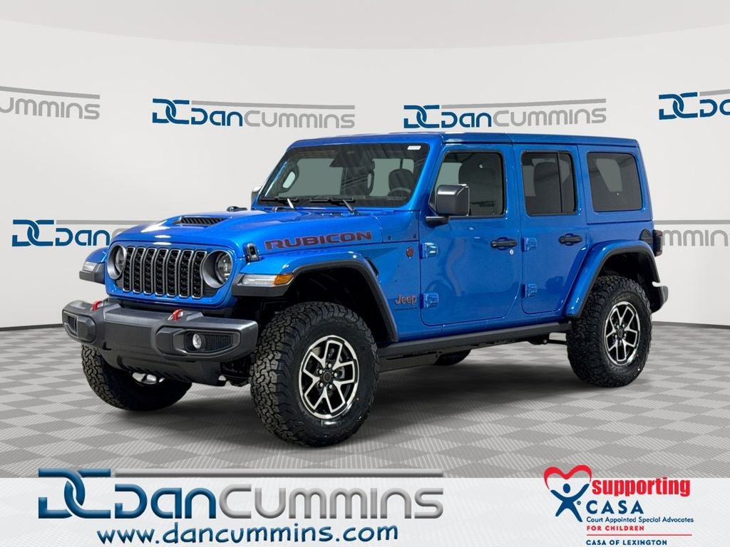 2026 Jeep Wrangler Rubicon in Hydro Blue Pearl-Coat Exterior Paint — front three-quarter view