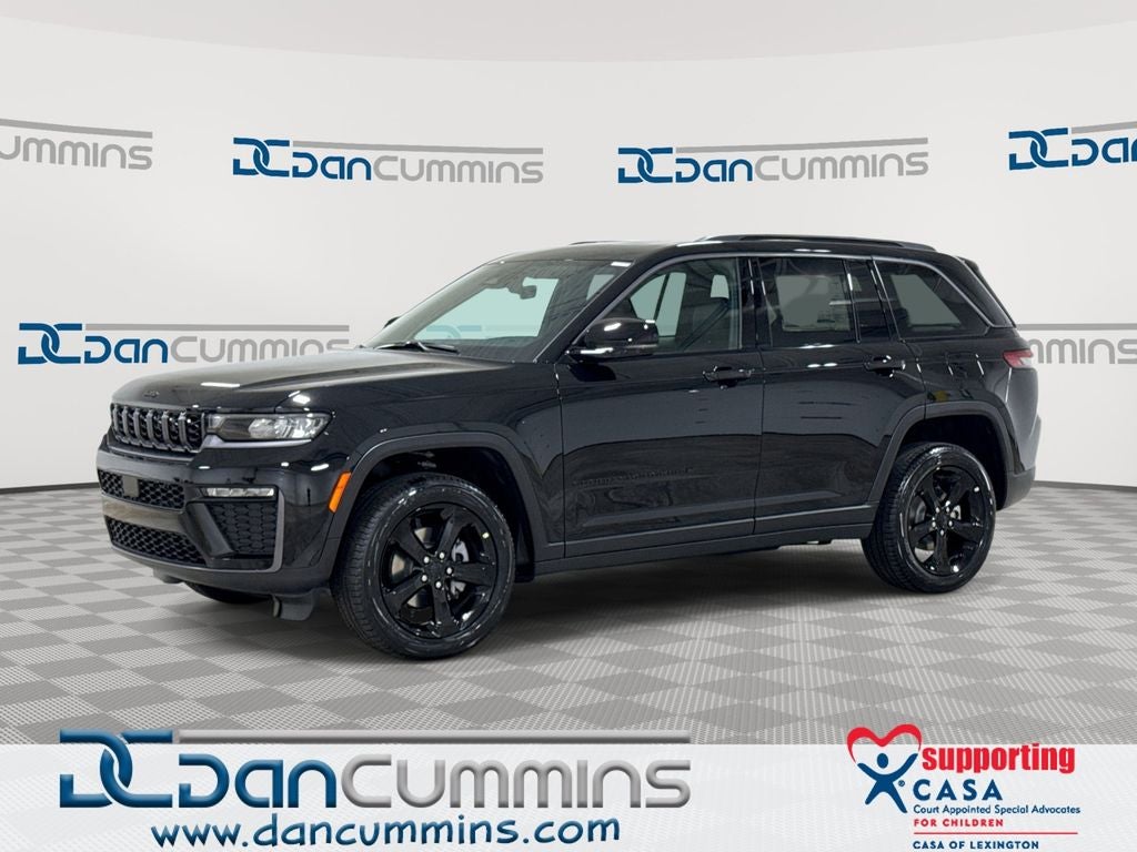 2026 Jeep Grand Cherokee Limited in Diamond Black Crystal Pearl-Coat Exterior Paint — front three-quarter view