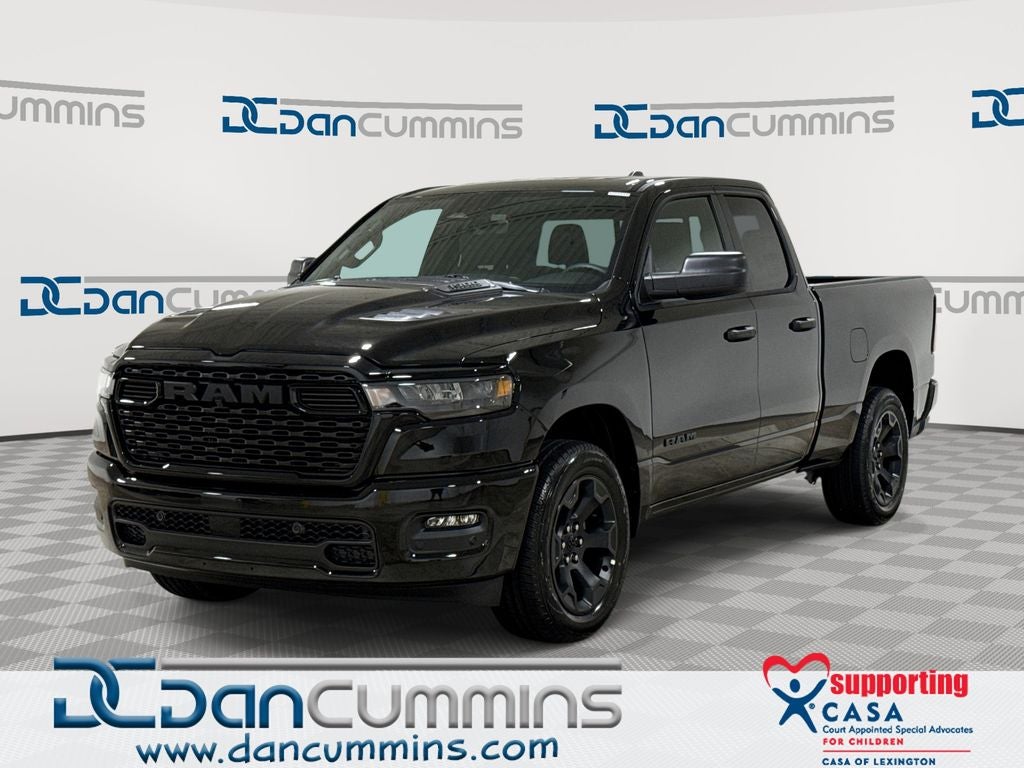 2026 RAM 1500 Express in Diamond Black Crystal Pearl-Coat Exterior Paint — front three-quarter view