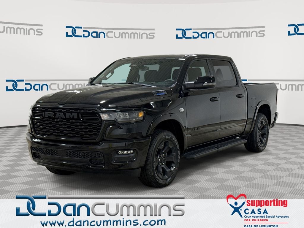 2026 RAM 1500 Big Horn/Lone Star in Diamond Black Crystal Pearl-Coat Exterior Paint — front three-quarter view
