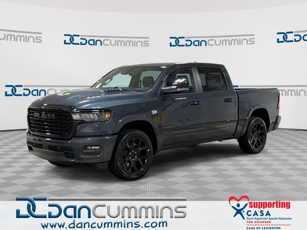 2026 RAM 1500 Laramie in Forged Blue Metallic Exterior Paint — front three-quarter view