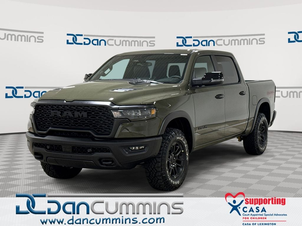 2026 RAM 1500 Rebel in Tank Exterior Paint — front three-quarter view