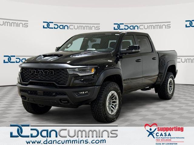 2026 RAM 1500 RHO in Diamond Black Crystal Pearl-Coat Exterior Paint — front three-quarter view