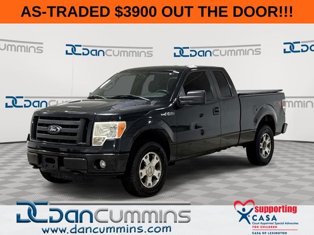 2010 Ford F-150 STX in Tuxedo Black — front three-quarter view