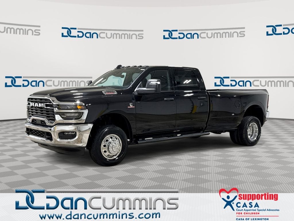 2026 RAM 3500 Tradesman in Diamond Black Crystal Pearl-Coat Exterior Paint — front three-quarter view