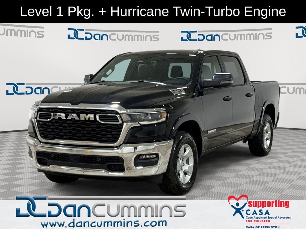 2026 RAM 1500 Big Horn/Lone Star in Diamond Black Crystal Pearl-Coat Exterior Paint — front three-quarter view
