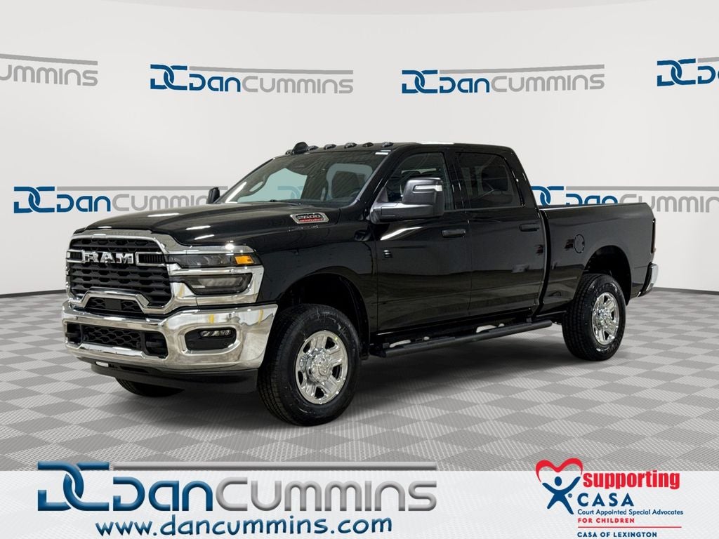 2026 RAM 2500 Tradesman in Diamond Black Crystal Pearl-Coat Exterior Paint — front three-quarter view