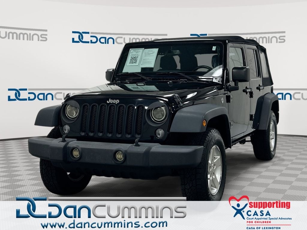 2017 Jeep Wrangler Unlimited Sport in Black Clearcoat — front three-quarter view