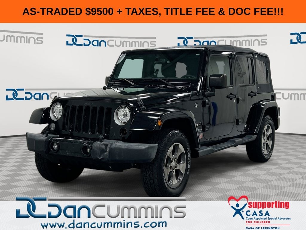 2017 Jeep Wrangler Unlimited Sahara in Black Clearcoat — front three-quarter view