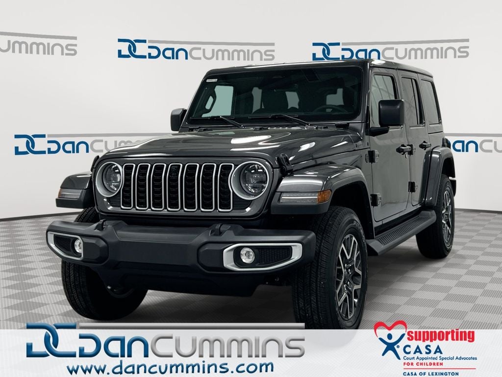 2026 Jeep Wrangler Sahara in Granite Crystal Metallic Clear-Coat Exterior Paint — front three-quarter view