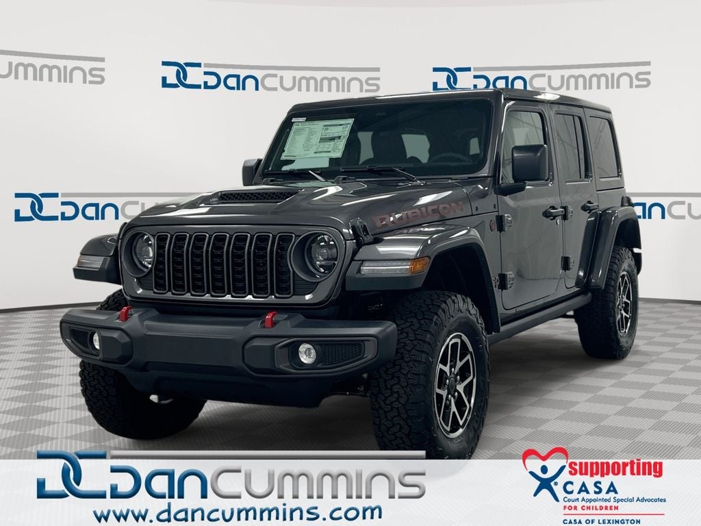 2026 Jeep Wrangler Rubicon in Granite Crystal Metallic Clear-Coat Exterior Paint — front three-quarter view