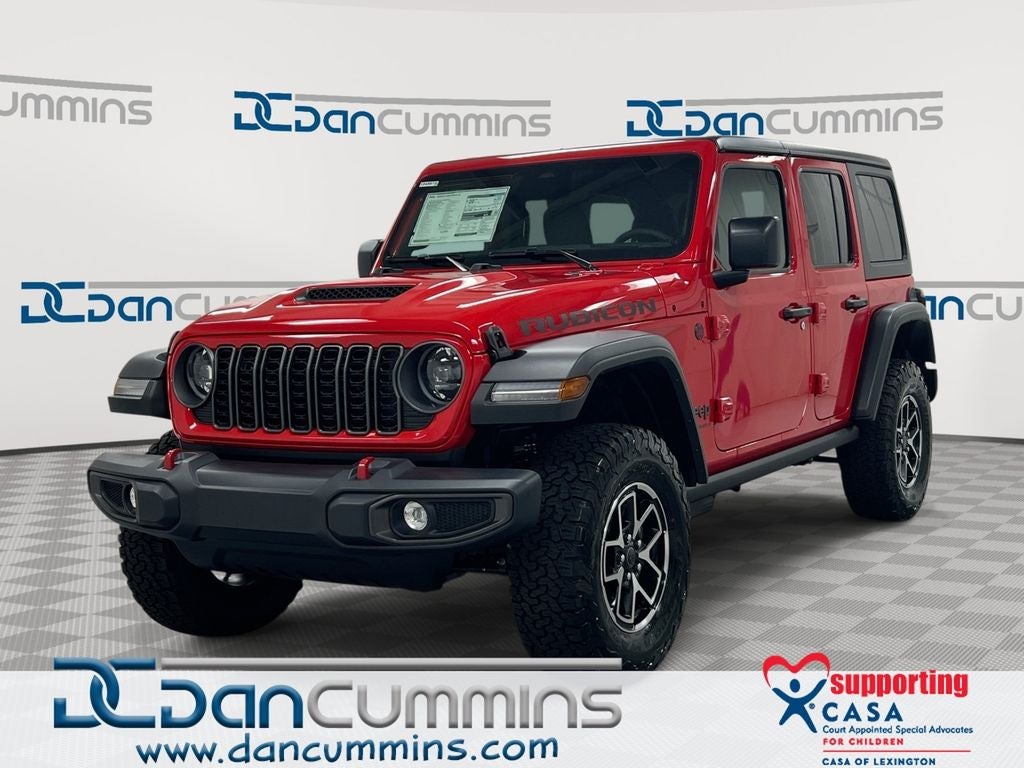 2026 Jeep Wrangler Rubicon in Firecracker Red Clear-Coat Exterior Paint — front three-quarter view