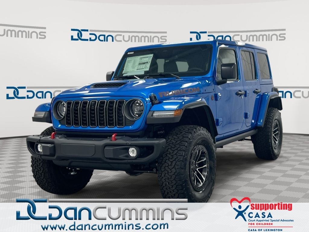 2026 Jeep Wrangler Rubicon X in Hydro Blue Pearl-Coat Exterior Paint — front three-quarter view