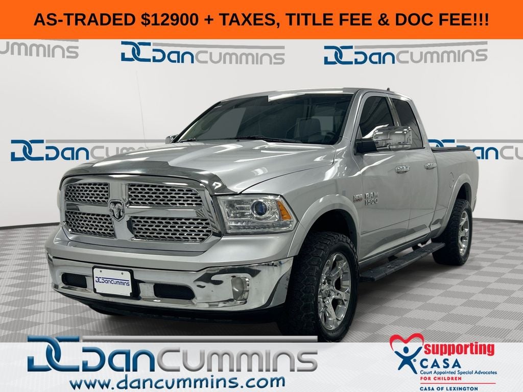 2014 RAM 1500 Laramie in Silver — front three-quarter view