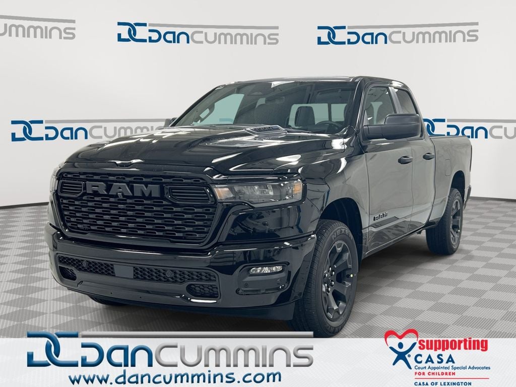 2026 RAM 1500 Express in Diamond Black Crystal Pearl-Coat Exterior Paint — front three-quarter view