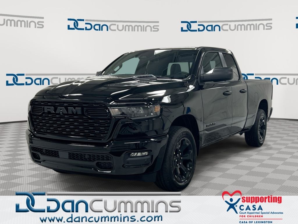 2026 RAM 1500 Express in Diamond Black Crystal Pearl-Coat Exterior Paint — front three-quarter view