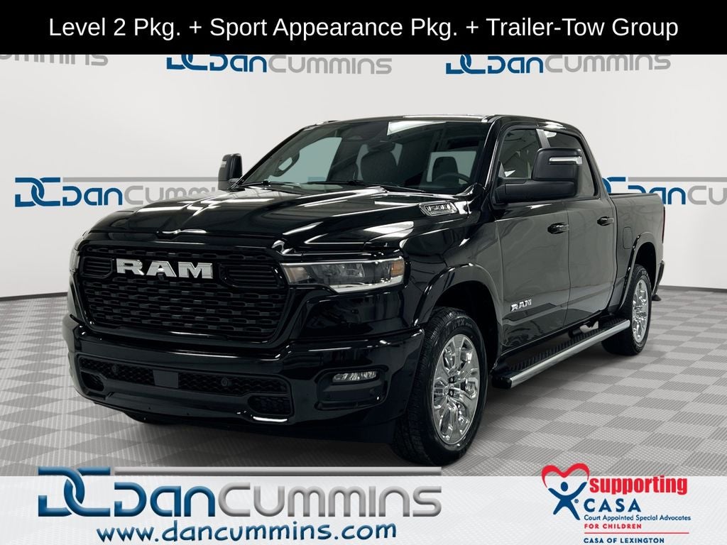 2026 RAM 1500 Big Horn/Lone Star in Diamond Black Crystal Pearl-Coat Exterior Paint — front three-quarter view