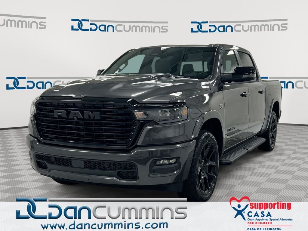 2026 RAM 1500 Laramie in Granite Crystal Metallic Clear-Coat Exterior Paint — front three-quarter view