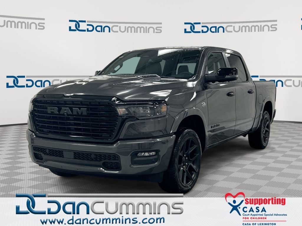 2026 RAM 1500 Laramie in Granite Crystal Metallic Clear-Coat Exterior Paint — front three-quarter view