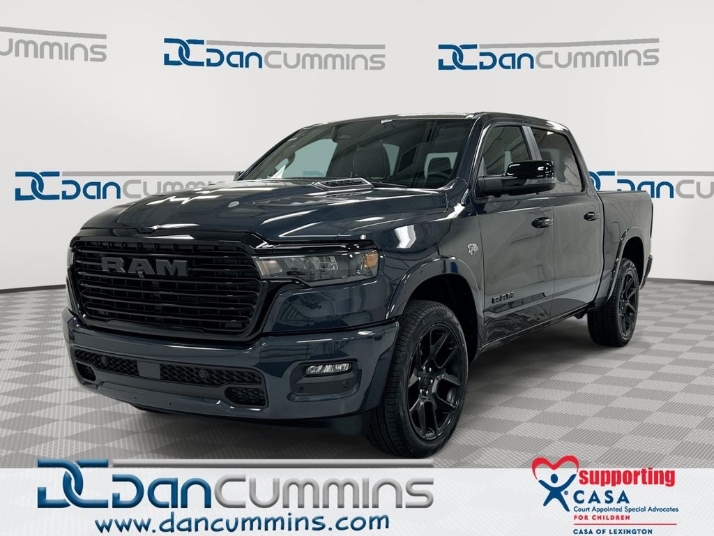 2026 RAM 1500 Laramie in Forged Blue Metallic Exterior Paint — front three-quarter view