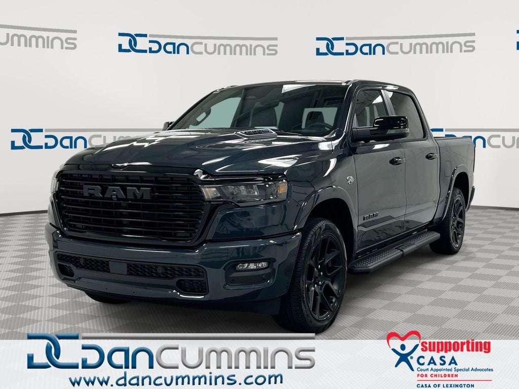 2026 RAM 1500 Laramie in Forged Blue Metallic Exterior Paint — front three-quarter view