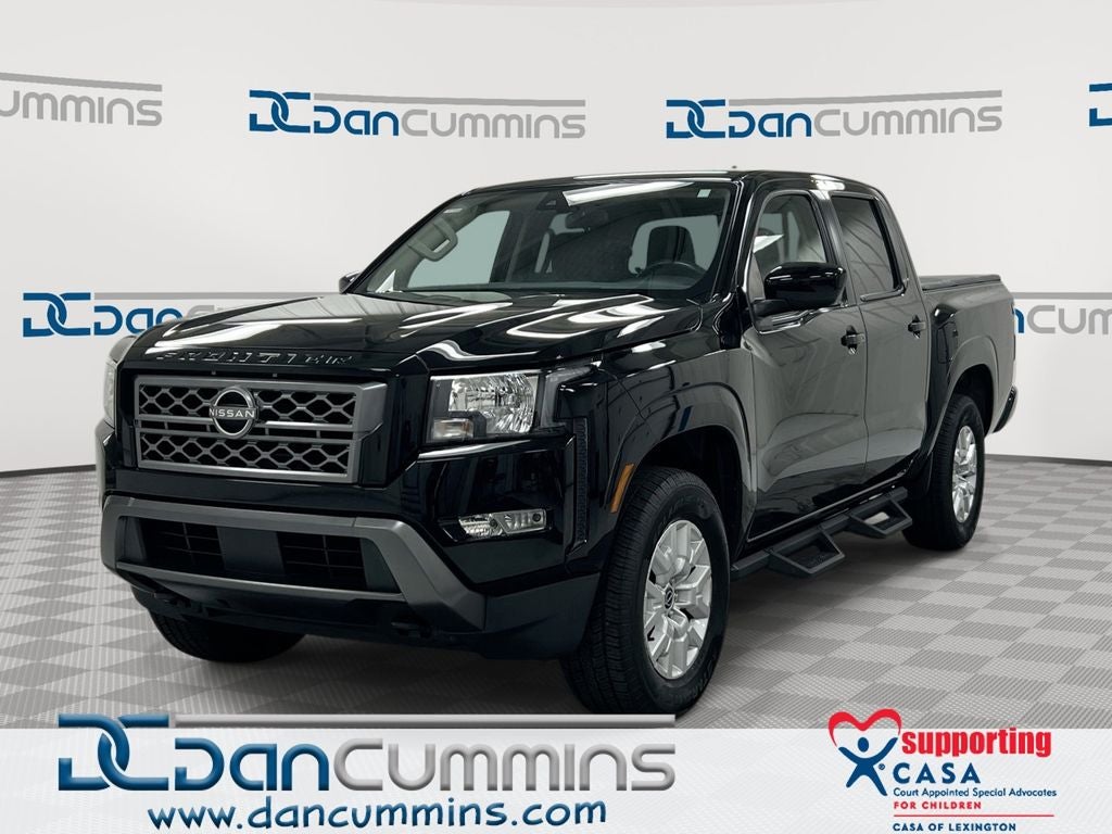 2022 Nissan Frontier SV in Super Black — front three-quarter view
