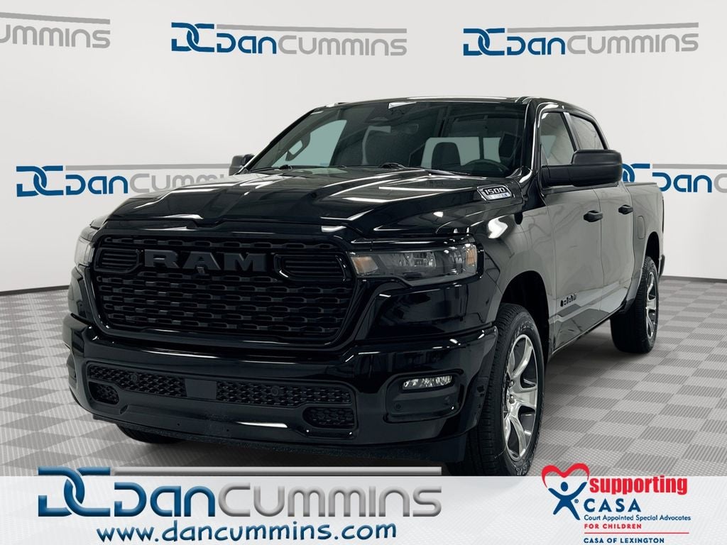 2026 RAM 1500 Express in Diamond Black Crystal Pearl-Coat Exterior Paint — front three-quarter view