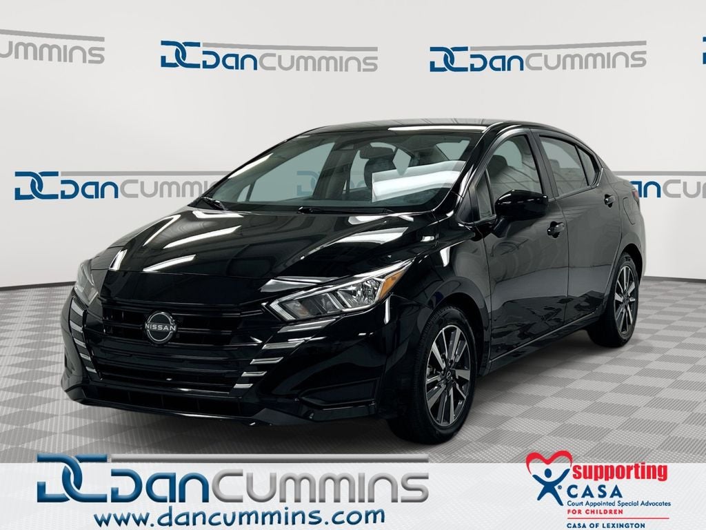 2023 Nissan Versa 1.6 SV in Super Black Metallic — front three-quarter view