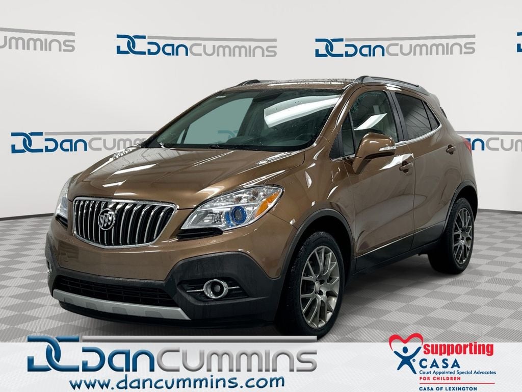 2016 Buick Encore Sport Touring in River Rock Metallic — front three-quarter view