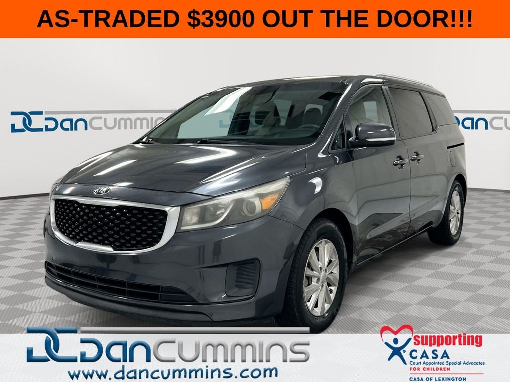 2016 Kia Sedona LX in Platinum Graphite Pearl Metallic — front three-quarter view