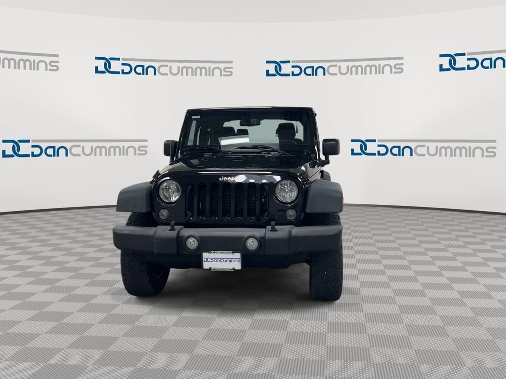2016 Jeep Wrangler — rear three-quarter view