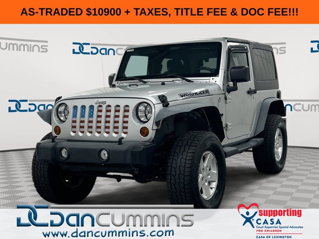 2012 Jeep Wrangler Sport in Silver — front three-quarter view