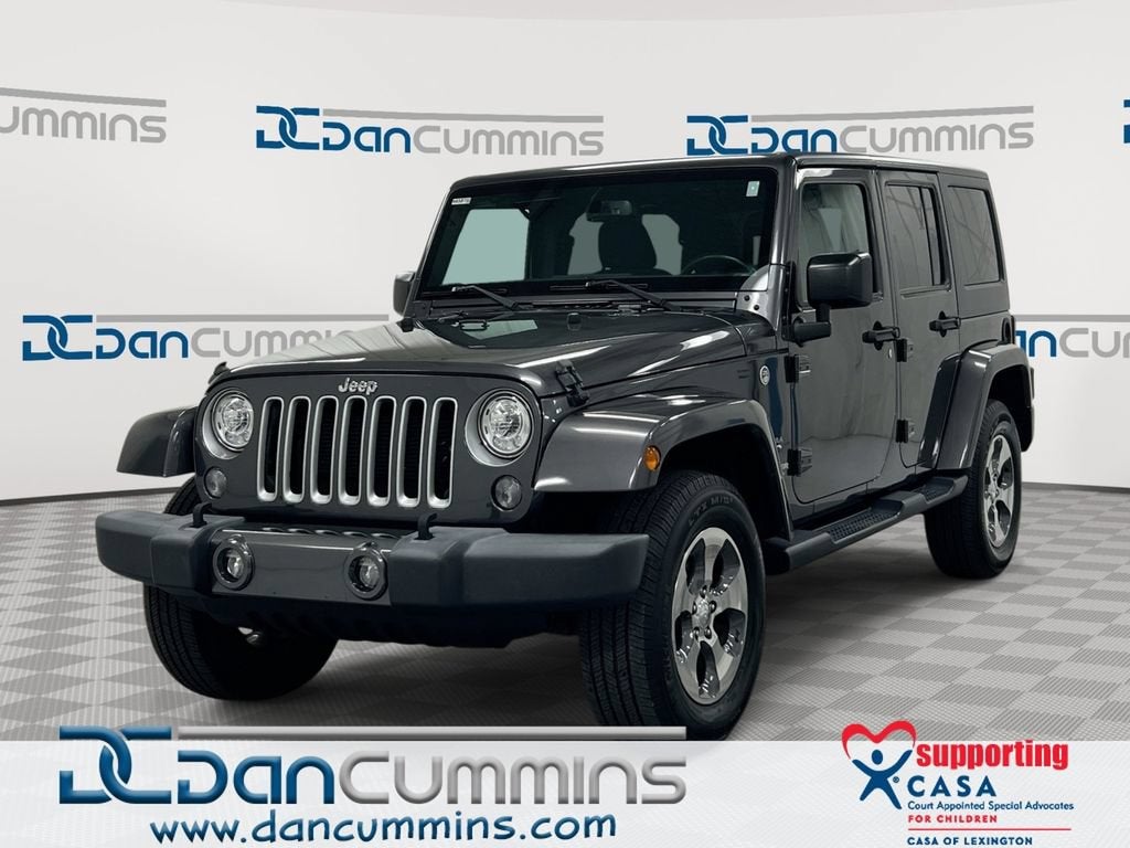 2017 Jeep Wrangler Unlimited Sahara in Gray — front three-quarter view