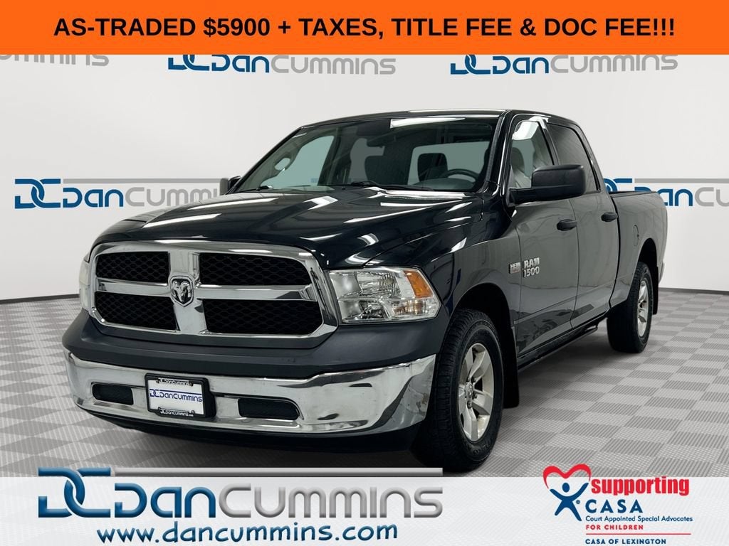 2016 RAM 1500 Tradesman in Black — front three-quarter view
