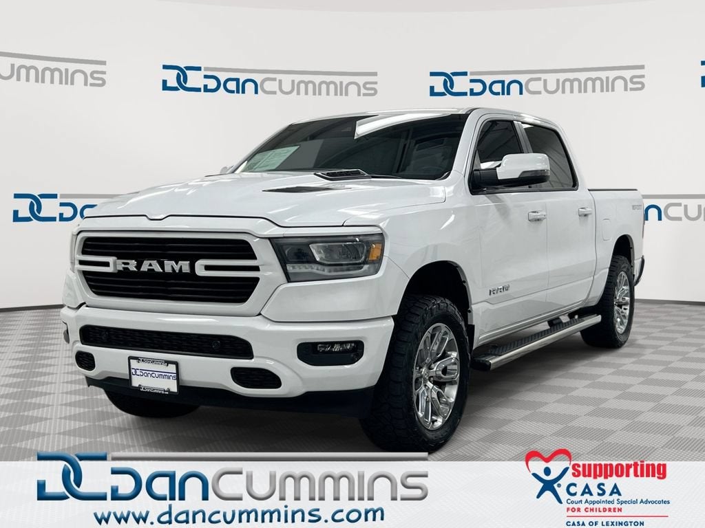 2023 RAM 1500 Laramie in White — front three-quarter view