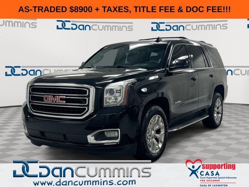 2016 GMC Yukon SLT in Onyx Black — front three-quarter view