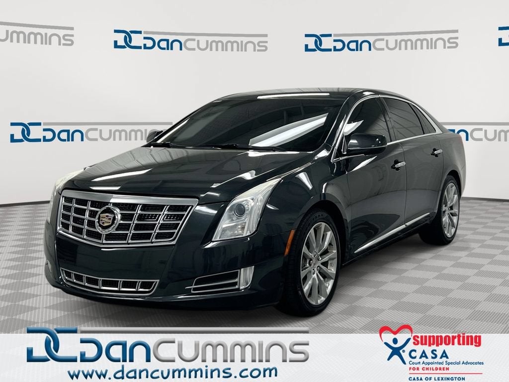 2015 Cadillac XTS Luxury in Graphite Metallic — front three-quarter view