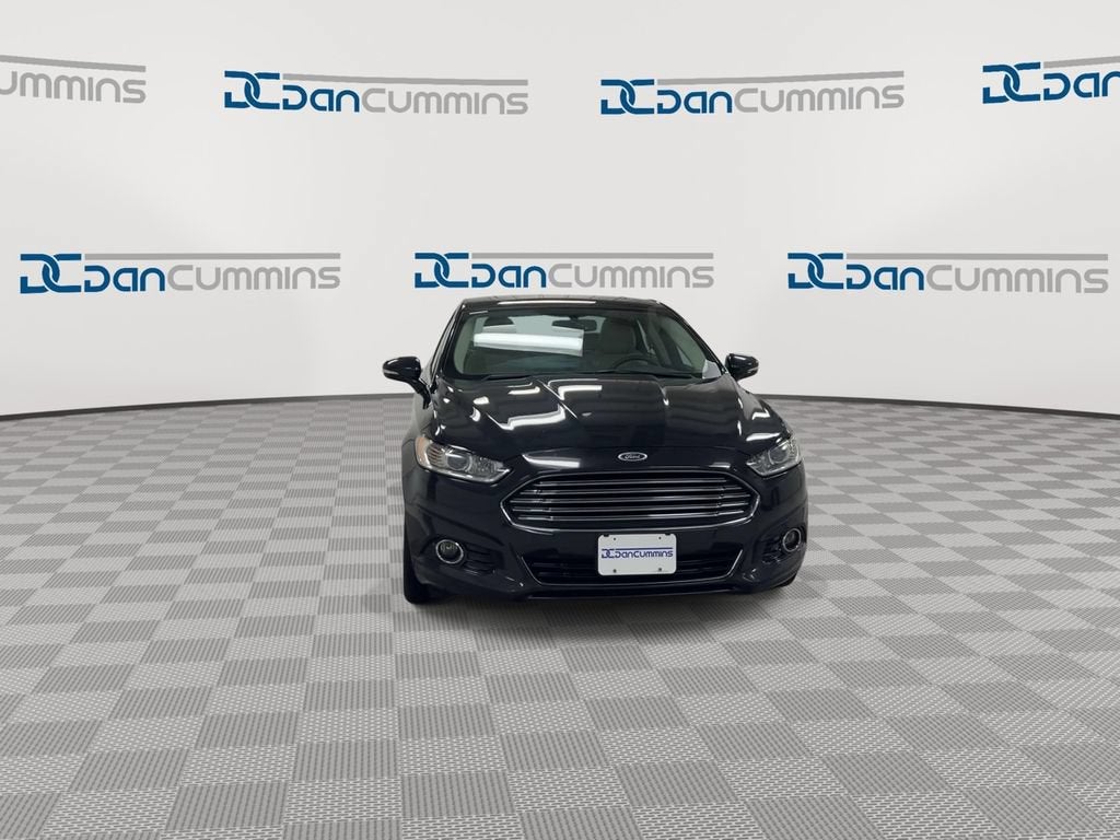 2014 Ford Fusion — rear three-quarter view