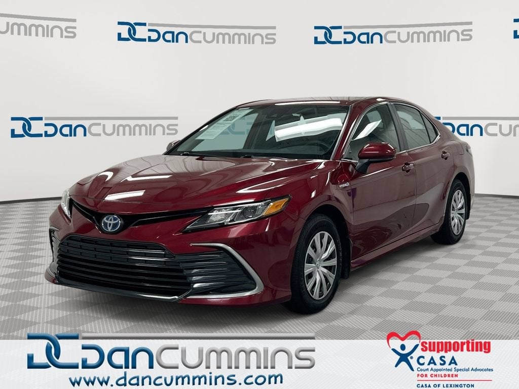 2021 Toyota Camry Hybrid LE in Red — front three-quarter view