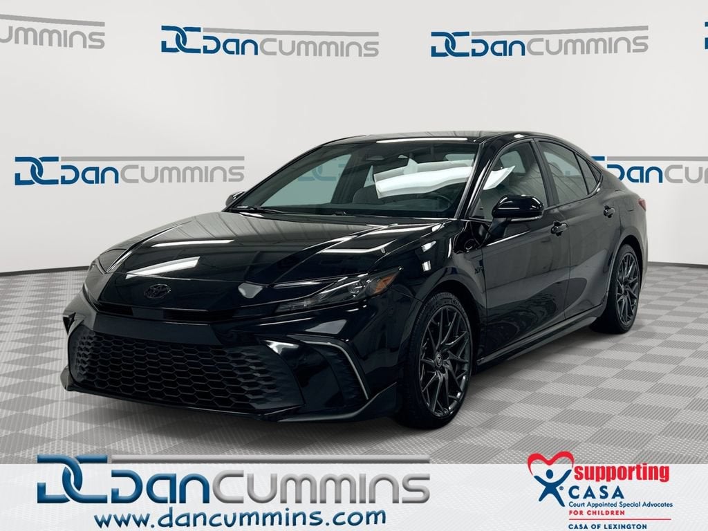 2025 Toyota Camry LE in Black — front three-quarter view
