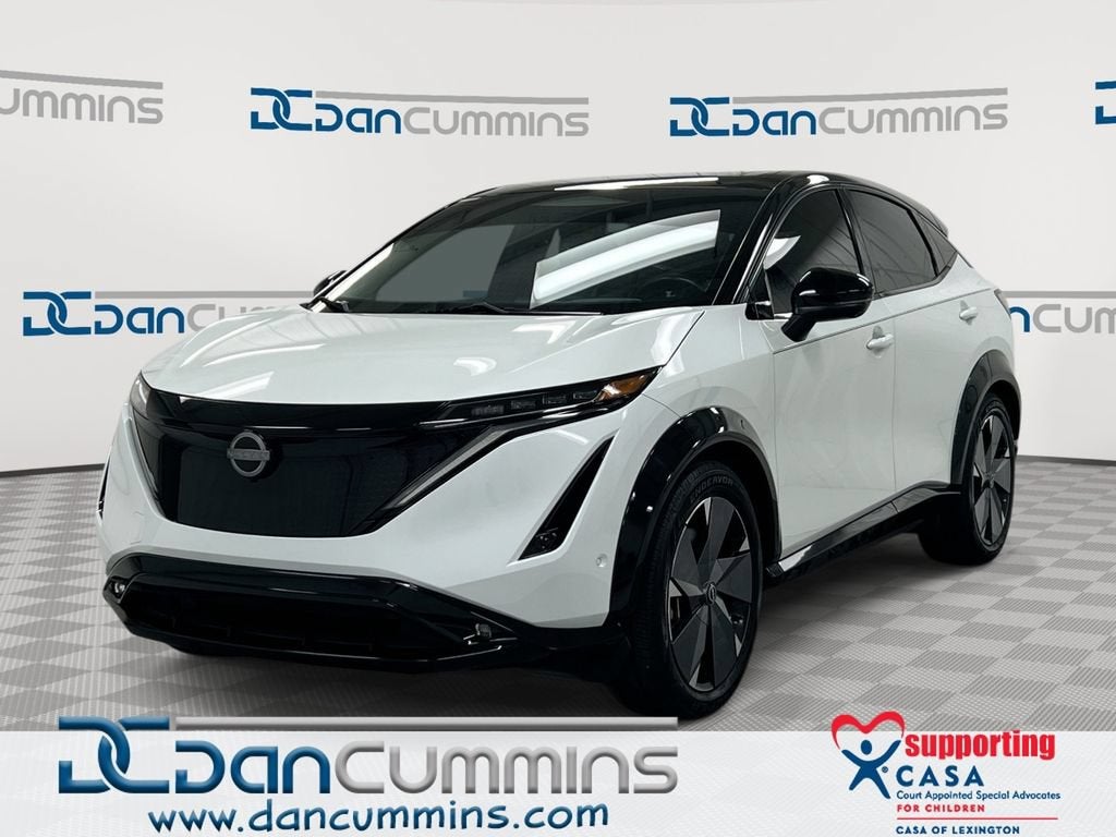 2023 Nissan ARIYA PLATINUM+ in White — front three-quarter view