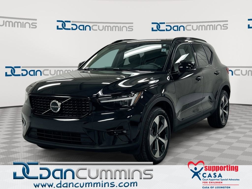 2024 Volvo XC40 Plus Dark Theme in Black — front three-quarter view