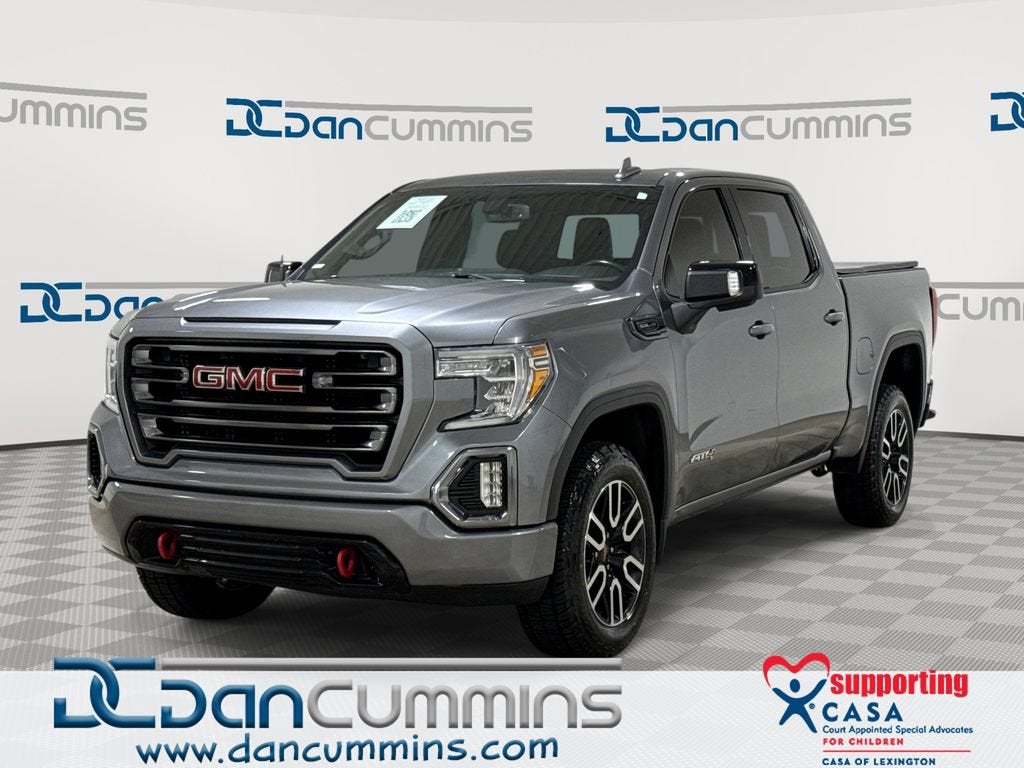 2021 GMC Sierra 1500 AT4 in Satin Steel Metallic — front three-quarter view