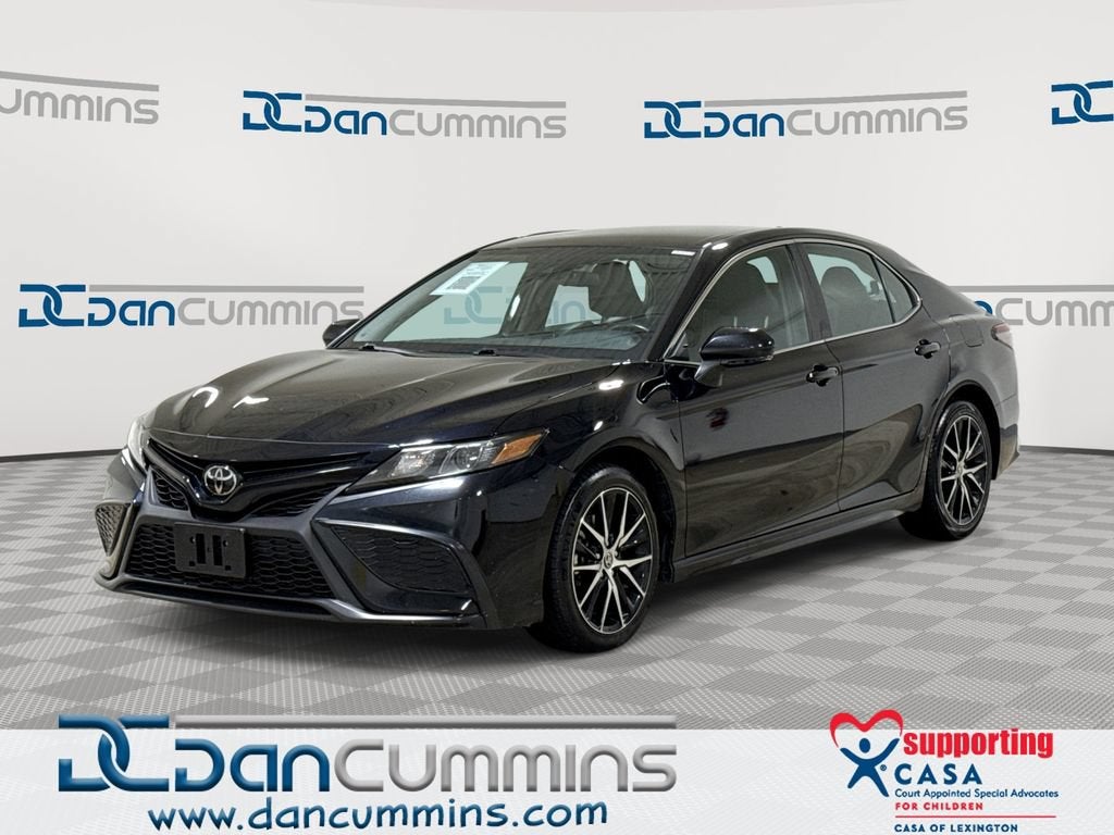 2024 Toyota Camry SE in Black — front three-quarter view